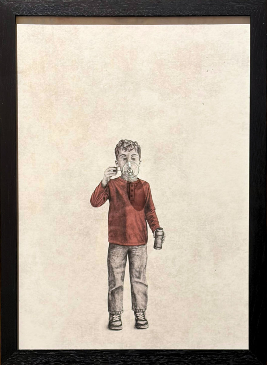 Andrew Scott's Glass Blower: Boy shows a child blowing a hand-blown glass bubble that projects from the monochrome print, creating a striking three-dimensional effect within the framed artwork