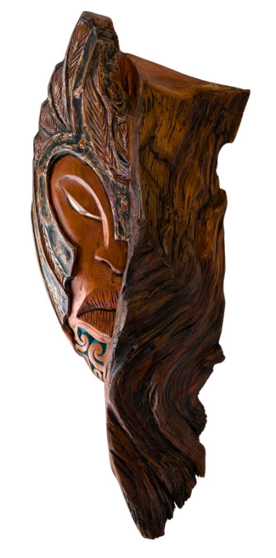 Joe Kemp’s Kāhu – NZ Harrier Hawk, a carved native timber sculpture featuring a Māori face, whalebone detailing and turquoise patterning