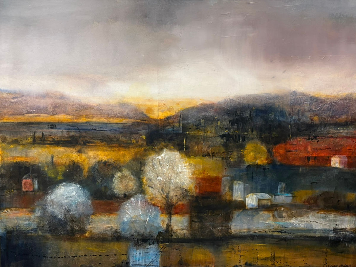 Mixed media painting by New Zealand artist Lyndy Wilson of an atmospheric river landscape with glowing golden light, dark hills, reflective water and softly defined trees and buildings